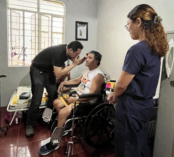 A man in a wheelchair being examined